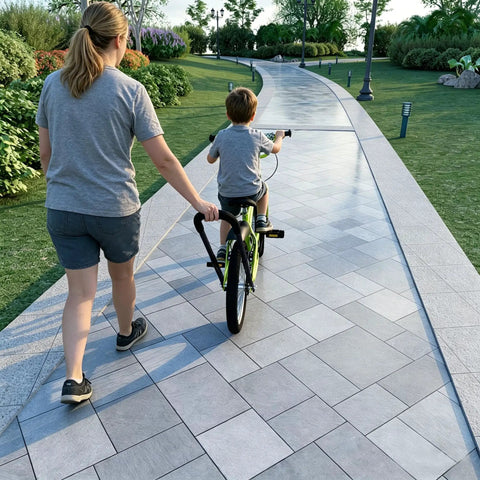 Parent guiding child on bike using Kids Bike Trainer Handle For Learning To Ride, Extended 21 To 30 Inch Balance Push Bar, Four Stage Height