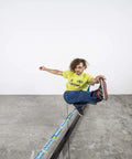 Person balancing on Slackhouse 3.0 Indoor Slackline Structure Built For Gym And Home Training with portable steel and polyester setup.
