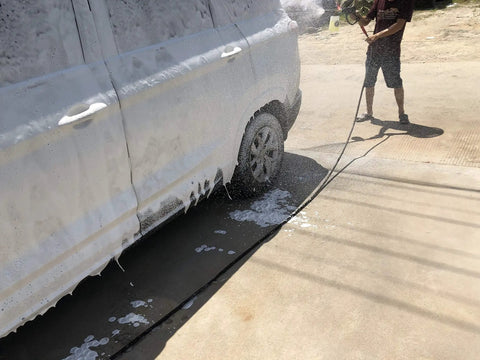 Vehicle being cleaned with Foam Cannon For SPX Series Pressure Washers With Five Nozzle Tips And One Quarter Inch Quick Connector