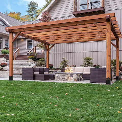 Beefy 4x4 Post Anchor Base With 3.6 X 3.6 Inch Inner Size installed under a wooden pergola in a backyard setting.