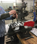 Person using a Bright Ball End Hex L Key Allen Wrench Combo Set Extra Long Inch And MM 22 Piece Two Sets in a workshop vise.