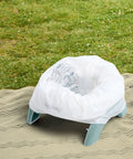 Road Warrior 2 In 1 Portable Baby And Toddler Travel Potty Seat With Secure Snap Ring Lightweight Foldable Design on grass.