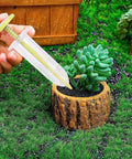 Go To Seed Spreader And Sowing Tool For Gardeners With Ergonomic Design Reusable Seeder in use near potted plant on grass