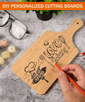 One bamboo cutting board with engraved cooking motifs; natural wood color, 11x5 inches, with handle.
