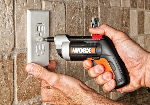 Person using 4V XTD Xtended Reach Cordless Screwdriver Pro Grade With Extending Shaft to fix an electrical outlet