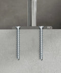 Two 3/8 Inch By 5 Inch Countersunk Head Titen HD Heavy Duty Screw Anchors For Concrete And Masonry installed in concrete