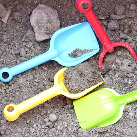 Image of blue, red, yellow, and green shovels from Eight Pack Heavy Duty Plastic Beach Shovels For Kids And Toddlers, Durable Sand Scoops For Beach Play And Sandbox Fun.