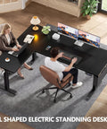Two people working at L Shaped Electric Standing Desk With Memory Presets 63 Inch Corner Sit To Stand Desk Adjustable Height