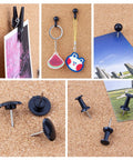 Top Tier Black Push Pin Set With Five Fresh Thumb Tacks And Sharp Steel Point Map Pins For Heavy Duty Cork Board Organization Rock Solid 140 Piece Desk Kit with various styles displayed on corkboard.