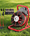 Heavy Duty Electric Drain Snake Machine With 75 Foot Steel Core Cable For Home And Shop Use To Knock Out Clogged Sinks Toilets And Sewer Lines Without The Fuss on grass with gloves and tools