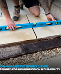 Pro Grade 2 Foot Aluminum Level Box Beam With Magnified Vials in use on tile install demonstrating precision leveling.