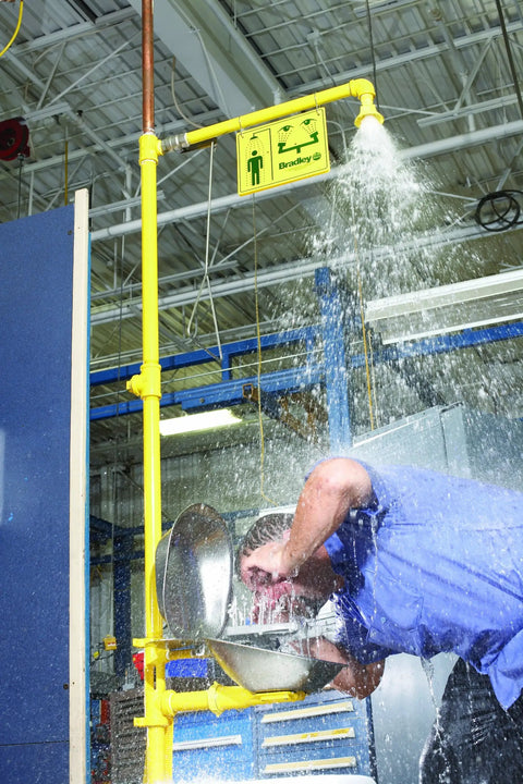 Heavy Duty Badass Industrial Combo Drench Shower And Eye Face Wash Station Galvanized Steel in use with water spray.