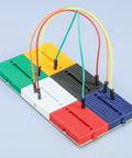 Colorful mini modular Solderless Prototype Breadboard Kit with 6x170 tie points showing easy pin insertion and reliable connections.