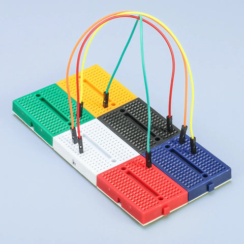 Colorful mini modular Solderless Prototype Breadboard Kit with 6x170 tie points showing easy pin insertion and reliable connections.