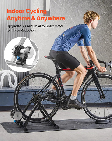 Foldable Fluid Bicycle Trainer Stand For Dope Indoor Rides With Progressive Resistance And Quiet Low Noise Operation Fits 26-29 Inch And 700C Wheels Includes Quick Release Skewer And Front Wheel Riser Block For Road Bikes, man cycling indoors.