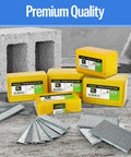 Boxes and stacks of 14 Gauge Concrete T Nails For Pneumatic Nailer Gun 1-1/2 Inch Galvanized Finish on concrete backdrop
