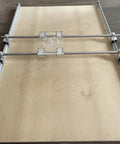 Dead On Precision Router Sled For Wood Slab Flattening Mill view showing 20mm steel tracks and acrylic mounting plate for lumber.