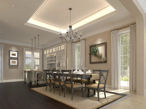 Elegant dining room with chandelier, dark wood table, and chairs next to large windows and decor. Ideal for gatherings.