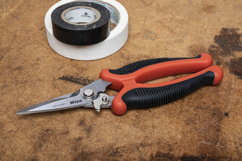 Eight And One Half Inch EZ Utility Snip for Home Improvement Repairs, serrated blade and grip handle, on workbench