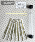 Gold Clock Hands And Quartz Movement Kit For DIY Wall Clocks with storage tube and thank you card on grid background