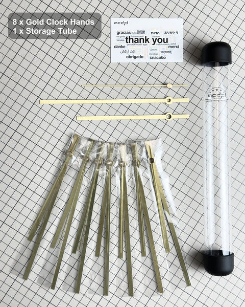 Gold Clock Hands And Quartz Movement Kit For DIY Wall Clocks with storage tube and thank you card on grid background