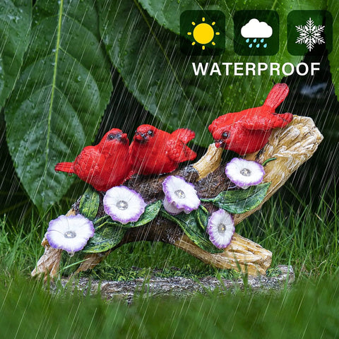 Cardinal Garden Statue With Solar Lights Outdoor Memorial Figurine Waterproof LED light in rain, featuring cardinals and flowers.