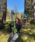Person using Backyard Zipline Trolley With Brake Race Car Style Handlebars Easy Speed Control Braking Stable Forward Facing Ride