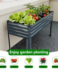 Heavy Duty Galvanized Raised Garden Bed With Legs For Outdoor Use 48 By 18 By 30 Inches Two Pack Metal Planter Box For Backyard Patio Or Balcony 300 Lb Capacity Gray With Safe Padded Corners filled with plants on a balcony