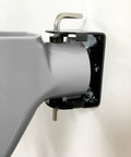 Wall-mounted side view of Wonder Winder Grab And Go Hand Crank Extension Cord Winder in heavy duty gray.