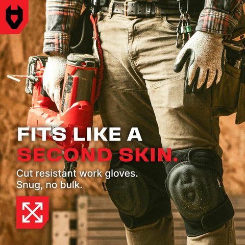 Man wearing Pro Grade Cut Resistant Work Gloves with Nitrile Grip, holding a tool with reinforced thumb, shown in a workshop setting.