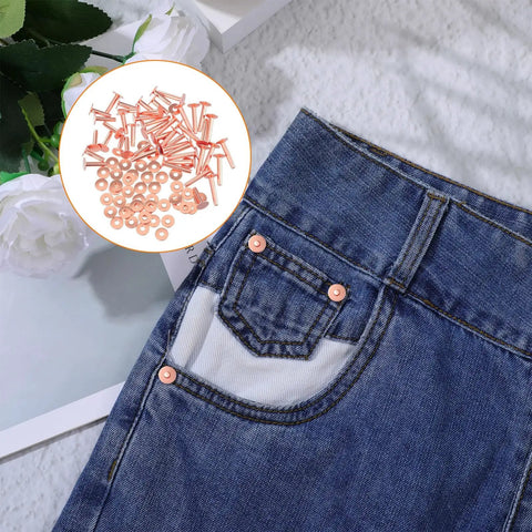 Pro Grade Copper And Brass Leather Rivet Kit 100Pcs All In One with rivets seen on jeans pocket, showcasing craft use.