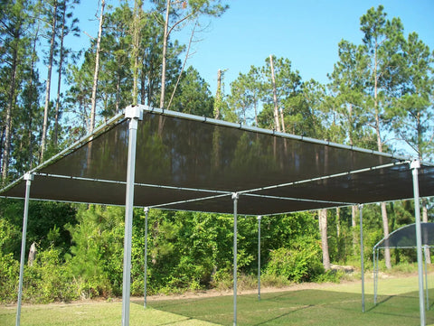 40 Percent Shade Cloth For Plants 10x50ft Sun Shade Fabric with Clips Black Durable HDPE Mesh over green area outdoors