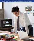 Heavy Duty Wireless Color Inkjet All In One Printer Featuring Precision Core Heat Free Technology And Durabrite Ultra Pigment Ink For Blazing Fast High Volume Home Office Printing That Really Slaps on a desk with documents, in a stylish office.