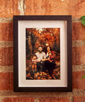 Photo Frame Diversion Safe With Hidden Compartment 4x6 Black Mini Safe Box hangs on a brick wall, displaying a family photo.