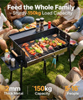 Group enjoying outdoor meal with Foldable Charcoal Grill With Three Temperature Settings, Windproof Camping BBQ setup at picnic.