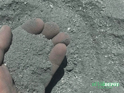 Hand holding Blue Grey Decomposed Granite 40 Pounds for easy install compactable outdoor pathways patios and walkways landscaping