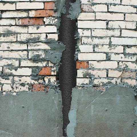 Pro Grade Foam Backer Rods 12 Pack For Expansion Joints used to seal a cracked brick wall, providing a tight fit in concrete gaps.