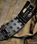 Close-up of MOLLE compatible sheath for Survival Knife With An 8 Inch Fixed Blade And Molle Compatible Sheath For Camping And Tactical Gear Desert Tan G10 Handle.