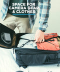 Person packing the Peter McKinnon Collab Camera Pack Expandable 35L To 42L Travel DSLR Backpack with camera gear and clothes.
