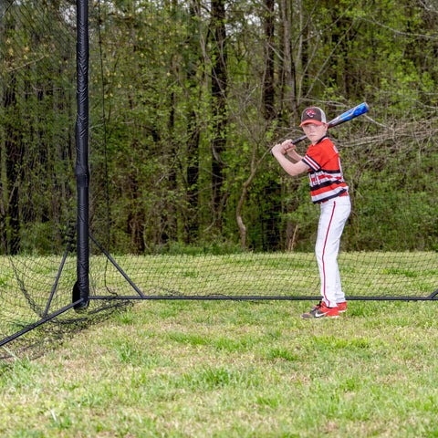 Heavy Duty Baseball and Softball Batting Cage With Wheels For Backyard Driveway And Club Training Commercial Grade Portable Cage Built Tough Steel Frame Premium Netting Easy Setup 40 Ft Practice Space with young player inside