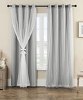 Ultra Soft Blackout Curtains With Crushed Sheer Overlay Block 90-95% Of Light 2 Panels Antique Silver Grommet Top Light Grey 52 Inch W By 84 Inch L Noise Reducing Room Darkening Drapes hanging on window in living room.
