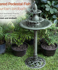 Outdoor 3 Tier Pedestal Water Fountain With Vintage Birdbath Accent In Green, surrounded by potted plants in a garden setting