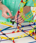 Roller Coaster Building Set With 546 Pieces And Motor Hands On STEM Toy For Ages 8 Plus Creative Building Kit For Solo Or Team Play Includes Ramp And Half Pipe Models, child assembling motor