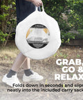 Person carrying Pop Up Mosquito Net For Bed And Camping Indoor Outdoor Bug Mesh Shelter in round white bag