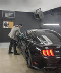 Hard Wired Ceiling Mount Garage Heater With Remote 7500 Watt 240 Volt Fan Forced Heat Overheat Protection Digital Thermostat 12 Hour Timer Space Saving Garage And Workshop Heating Toasty installed in garage ceiling above a car detailing workspace.