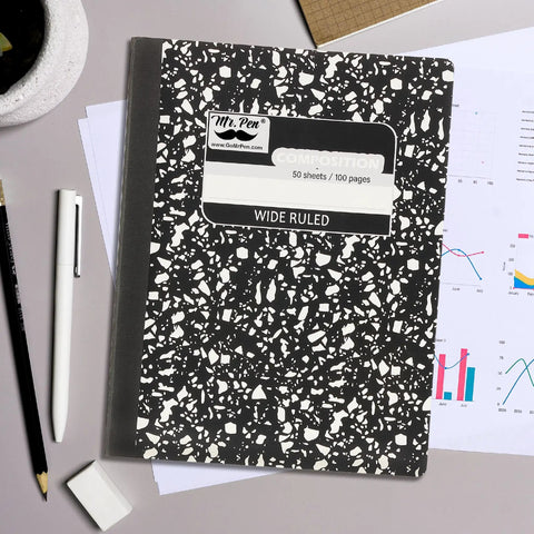 Bulk 24 Pack Composition Notebooks With 50 Sheets Each, Wide Ruled, 9.75 By 7.5 Inches, Hard Cover Black Marble on desk
