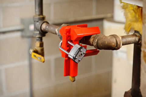 Red Ball Valve Lockout For One Half To Two And A Half Inch Pipe, Fits One To Two Inch Valve Handles, Polypropylene Body, Lockout Capable For Up To Four Padlocks, Boss Level Industrial Tagout Gear For Maintenance And Shutdown Procedures.