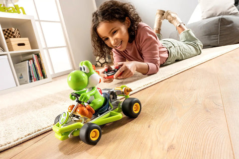 Child playing with Official Licensed Mario Kart Pipe Kart Yoshi 1 to 18 Scale RC Car 2.4 GHz Ready to Run with Rechargeable LiFePO4 Battery