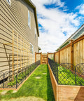 Decorative Garden Fence Panels 24 Inch High By 13 Inch Wide Diamond Mesh Rustproof Metal Animal Barrier and Landscape Border installed along garden path
