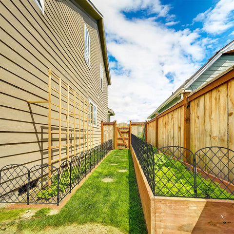 Decorative Garden Fence Panels 24 Inch High By 13 Inch Wide Diamond Mesh Rustproof Metal Animal Barrier and Landscape Border installed along garden path